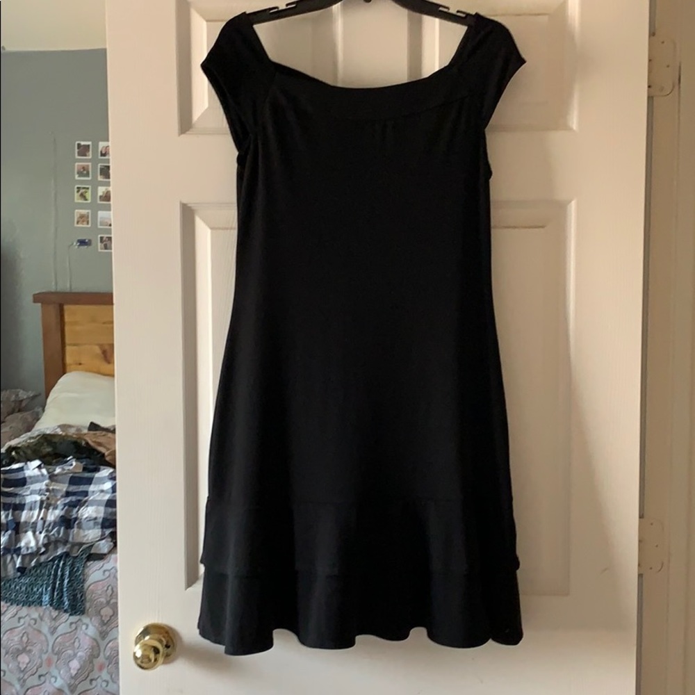 Knee length black dress.